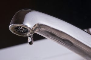 Old Chrome Tap Dripping Water